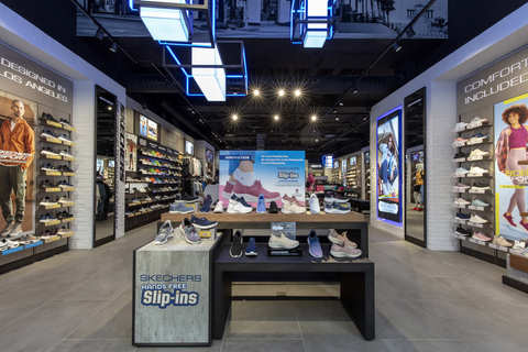 Illuminated by a vaulted entry, the new Skechers Brussels retail store showcases Skechers' expansive lifestyle comfort range, and features dedicated Skechers Performance and Skechers Apparel areas. (Photo: Business Wire)